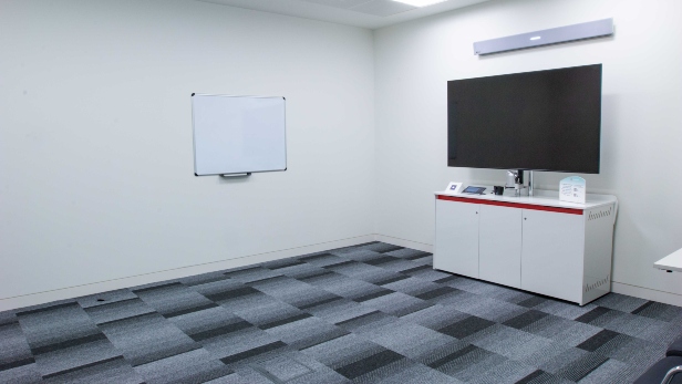 Blue conference room located in Johnson & Johnson Institute in Wokingham, United Kingdom