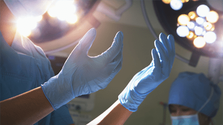 An image of a surgeon wearing gloves - Hands on Training Labs