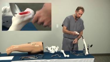 An image of Dr. Schwab demonstrating his retractor placement for femoral exposure during the anterior approach.