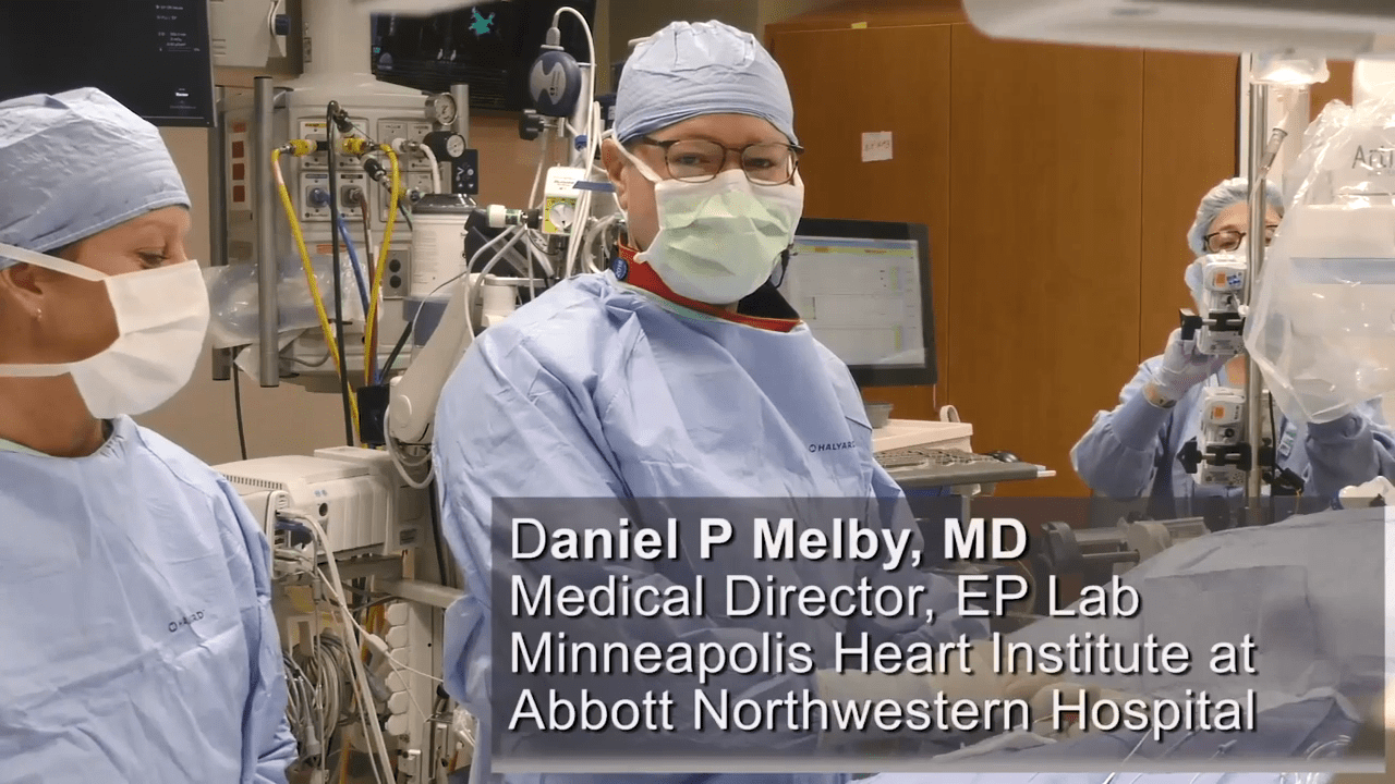 Dr. Melby in a clinical setting, with his team